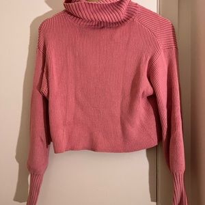 Cropped pink turtleneck sweater